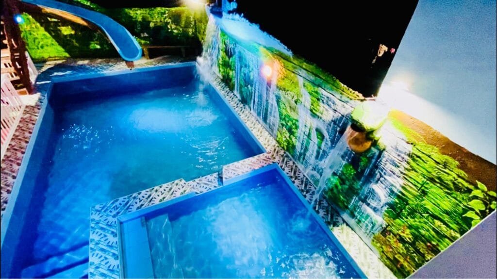 Refreshing 4 bedroom home with a waterfall pools