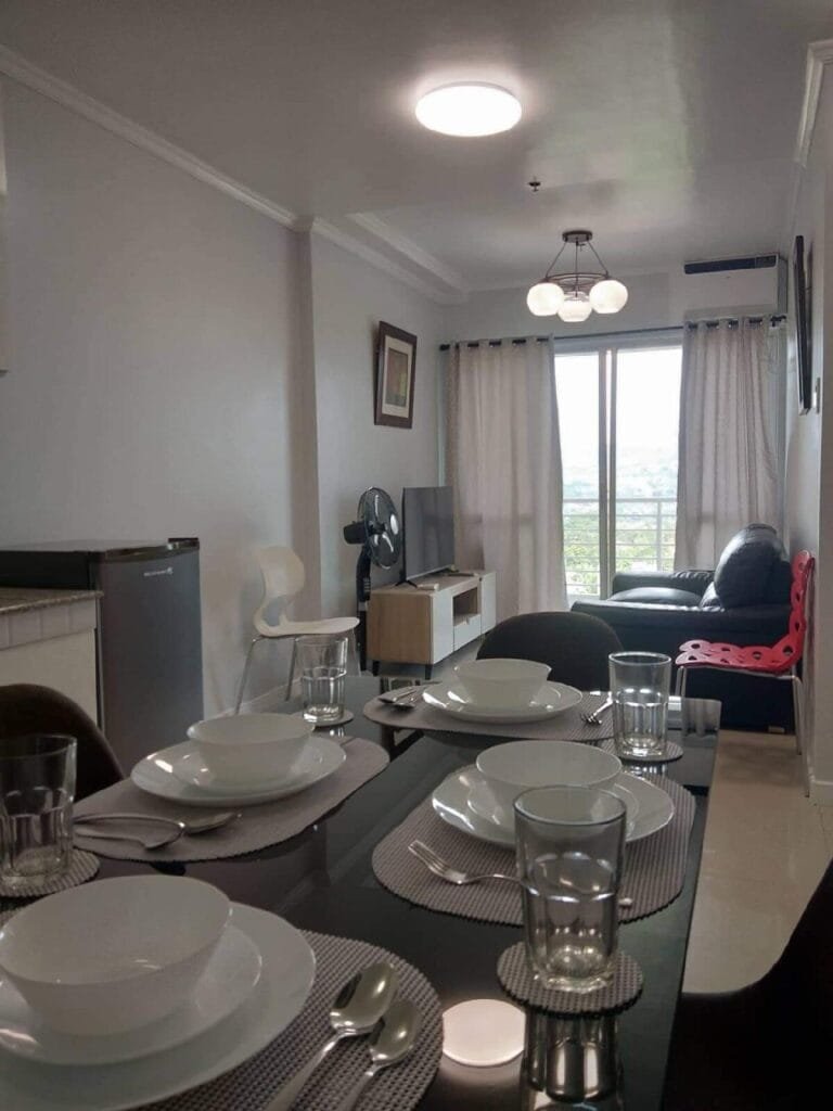 Two- bedroom condo with garage parking and a pool