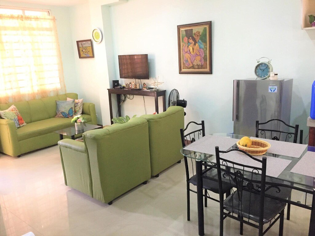 Exterior view of a cozy two-bedroom vacation rental house located in Gustilo, La Paz, Iloilo City, Philippines, featuring a welcoming facade and local neighborhood charm.