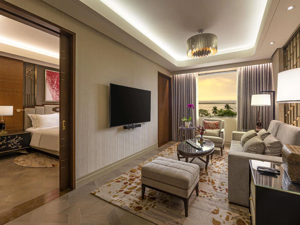 Luxury boutique hotel room at Admiral Hotel Manila MGallery Collection featuring elegant Art Deco design, plush bedding, and views of Manila Bay.