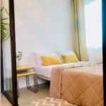 Cozy and modern interior room design of Room 92 at Agape Staycation in Manila Philippines featuring stylish decor and comfortable bedding.