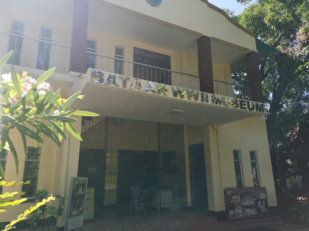 Historic military artifacts, dioramas, and wartime memorabilia displayed inside the Bataan WWII Museum in Balanga, Philippines.