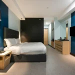 Modern studio apartment room with a city view at Bay Area Suites Manila hotel in Malate, Manila, Philippines.