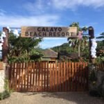 Scenic view of the calm turquoise waters and pristine sandy shore at Calayo Beach Resort in Nasugbu, Batangas, Philippines.