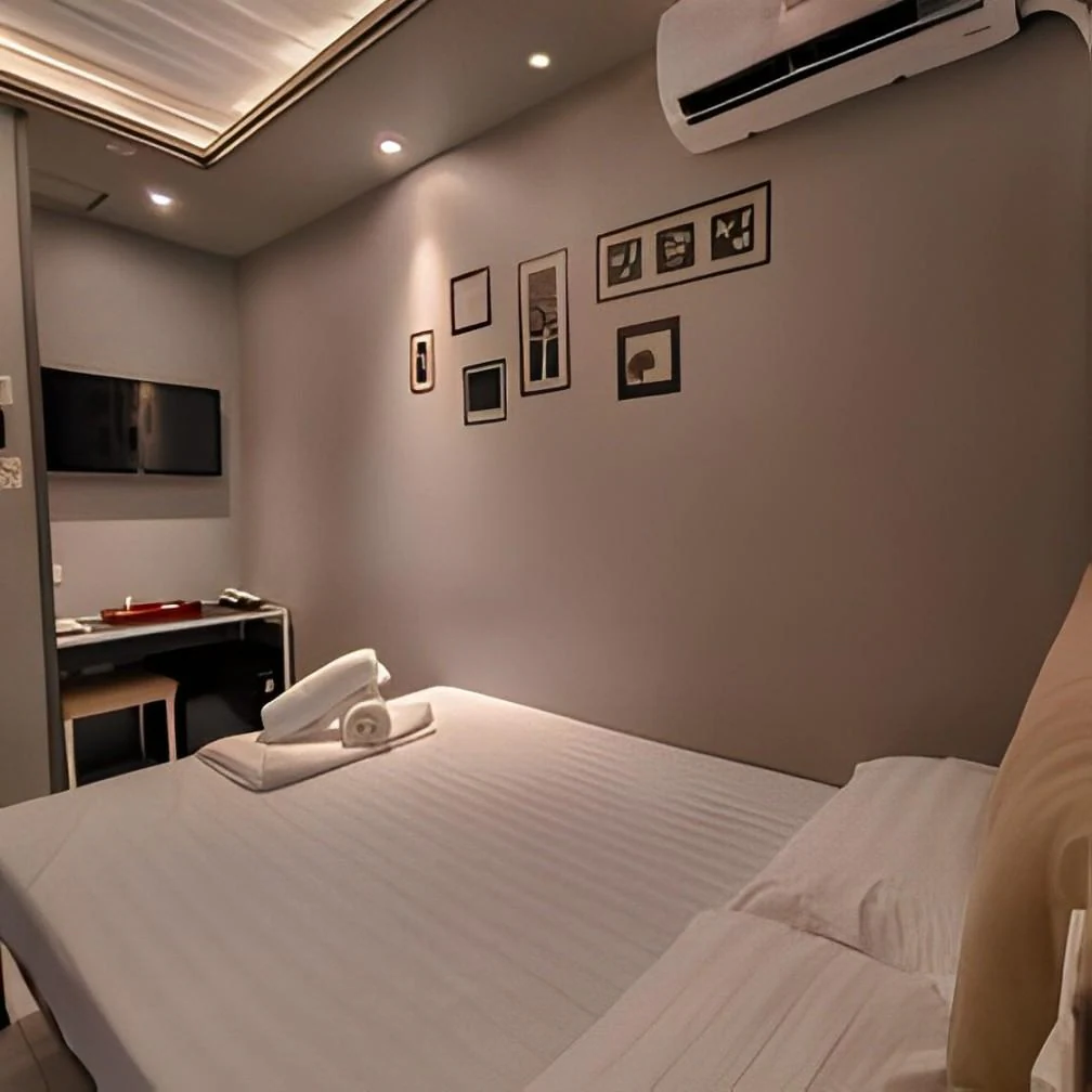 Modern and cozy interior room at Hotel Snow in Angeles City near Clark, Philippines, featuring clean minimalist decor and warm lighting.