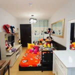 Mickey and Minnie Mouse themed studio apartment at One Oasis Condominium in Manila, Philippines, featuring Disney bedding, plush toys, a vanity mirror, and custom decor.