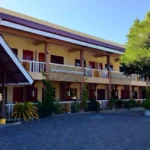 Exterior view of Panglao Island Franzen Residences in Bohol Philippines showing the modern tropical budget hotel facade near Alona Beach.