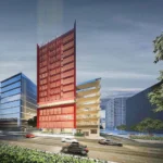 Architectural concept rendering of Red Hotel Cubao in Quezon City, showing a modern high-rise building with a striking red facade along a multi-lane street at dusk.