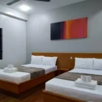 Boutique hotel room interior at a luxury sea view resort in Siquijor Island, Philippines, featuring large windows overlooking the ocean.