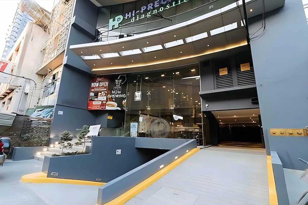 Modern grey exterior facade and main entrance driveway of Skyloft Hotel near UST in Manila.