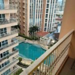 Balcony view from ThePearl Executive Studio at Venice Luxury Residences in Manila Philippines looking down at the scenic Venice Grand Canal layout.