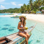 Aerial view of a pristine white sand beach and crystal-clear turquoise waters at a popular tourist spot on Bantayan Island, Cebu.