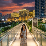 A clear street-level pedestrian route map showing the easy walking path from Bayprime Hotel entrance to the gold facades of City of Dreams Manila luxury resort.